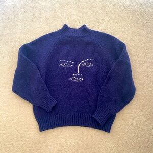 blue abstract face sweater